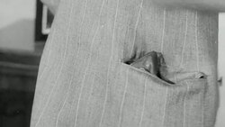 1943 MONTAGE John's wife tending his suit / United Kingdom Stock Footage