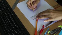 Female architect drawing house in office Stock Footage