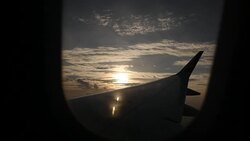 Wing of a Airplane at sunset Stock Footage