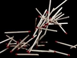 Matches falling against Black background, Slow motion Stock Footage