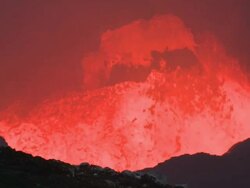 Large chunk of rock collapses into lava lake near volcanologist, Marum Volcano, Ambrym Island, Vanuatu Stock Footage