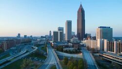 Day to night Time lapse transition - Elevated view over traffic and the Midtown Atlanta skyline, Georgia, United States of America Stock Footage