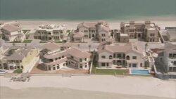 Mansions line a sandbar in Dubai. Stock Footage