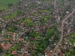 WS AERIAL ZO View of church and houses along with railway tracks at Obersuhl / Germany Stock Footage