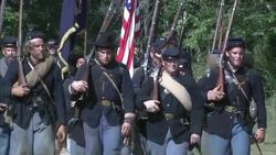 Union soldiers carry the Union flags as the cavalry follows. Stock Footage