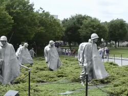MS PAN People roaming at statues in platoon at new korean war veterans memorial with bronze statues in Mall / Washington DC, Washington District of Columbia, United States Stock Footage