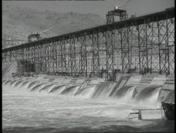 Water flows through the Grand Coulee Dam. News Clip