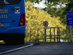MS Tourist bus from CatarataÃ‚Â´s Park and kilometer sign / Foz do Iguacu, Parana, Brazil Stock Footage
