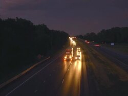 MS TS Shot of Elevated view of truck and auto traffic on interstate highway at night / Chelsea, Michigan, United States Stock Footage