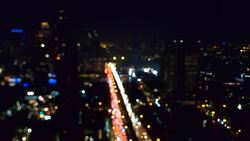 Bokeh of Bangkok cityscape at night Stock Footage