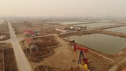 Aerial View of Petrochemical Plant, Oil Pumping Unit and Air Pollution In China Stock Footage