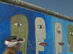 Jogger in front of  Berlin Wall, Grafitti, Murals, Stock Footage