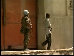 Food riot at aid station, police fire shots News Clip