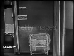 1952: KEFAUVER CAMPAIGN HEADQUARTERS: VS DOLLYING THROUGH Raleigh Hotel suite w/ VO Frank Bourgholtzer, Moving up hallway w/ volunteers, female, male, walking by, moving into Press Room, VS People, poster, ad, keepsakes. Instructional Video