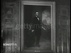 1936: U.S. WHITE HOUSE: DINING HALL & RED ROOM: INT WS State dining room, servant. MS Portrait of Ex President Abraham Lincoln. MS Fireplace. MS Servant opening door to Red Room. LA MS Chandelier. (POV doorway) Red Room, servant. Washington D.C. Instructional Video