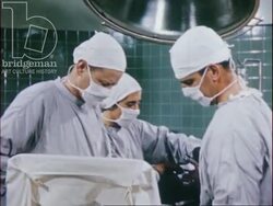 Medical staff at work, researching, operating and testing tissue for cancer, 1954 Stock Footage