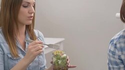 Two female friends on casual lunch break Stock Footage