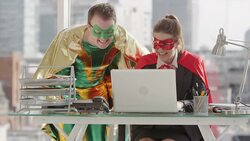 Superheroes working in business office Stock Footage