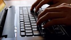 hand typing on laptop computer keyboard Stock Footage