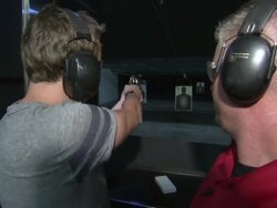 Man firing pistol at target News Clip