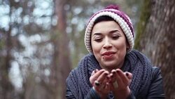 A gorgeous young girl with a trendy patchy cap laughing and sending kisses Stock Footage