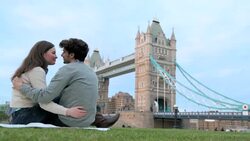 A young couple kiss near the Tower Bridge in London. Stock Footage