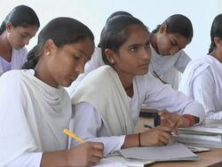 MS Girls writing and listing  to teacher in class / Himachal Pradesh, India Stock Footage