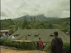 Thousands evacuated from slopes of a rumbling volcano News Clip
