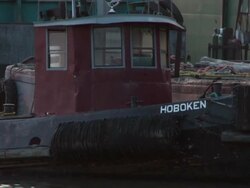 Close up of a tub boat floating in Hoboken Stock Footage