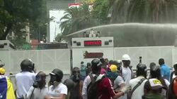 CLEAN : Protesters dispersed with water cannon tear gas in Caracas News Clip