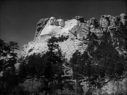 B/W 1936 long shot wide shot unfinished Mt. Rushmore at unveiling ceremony / South Dakota / newsreel Stock Footage