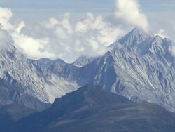 HD Clouds moving over high mountains time lapse Stock Footage