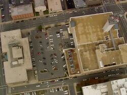 WS AERIAL View of street buildings and cars in parking lot at Greensboro / North Carolina, United States Stock Footage