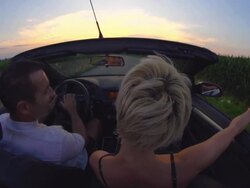 HD SLOW MOTION: Couple Driving Late In Convertible Stock Footage