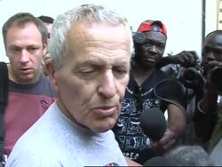 WRAP Belgian pilot arrives at court for hearing on children; ADDS analyst News Clip