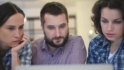 Two beautiful girls and man with laptop device Stock Footage