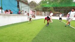 Man slides into attack on goal, recovers in local soccer match Stock Footage