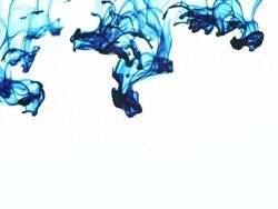 Blue Dye in Water Falling and Swirling Background Stock Footage