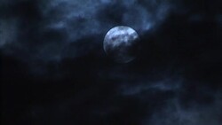Full moon eerily shrouded by smoke or clouds on Bonfire Night News Clip