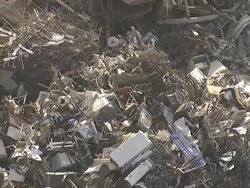 Medium Long Shot aerial tracking-left zoom-out - Household waste lies in a heap at a city dump. / Los Angeles, California, USA Stock Footage