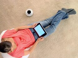 CU ZO Woman watching footage on digital tablet / London, London, United Kingdom Stock Footage