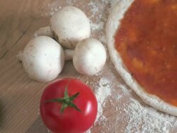 Camera movement over tomato sauce on pizza base Stock Footage