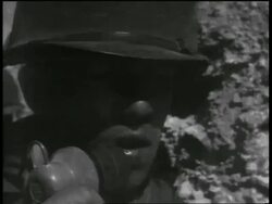 B/W 1955 close up soldier counting down into microphone during atomic testing / Nevada / documentary Stock Footage