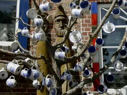MS Shot of Cups on Tree at Pottery shop  / Middelhagen, Rugen/Mecklenburg, Germany Stock Footage