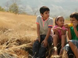 Three Kids eating corn at hill station Stock Footage