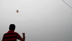 A kite with the photo of Narinder Modi, the PM of India, in the Indian tricolour on the occasion of India's Independence Day, being popular during this season Stock Footage