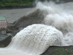 Flood Water Flows Down Spillway Of Hydroelectric Dam Stock Footage