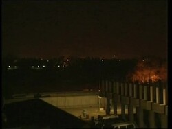 Warning siren as curfew starts at dusk, plus night skyline News Clip