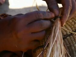 CU Himba woman hands weaving basket / Himba, Kunene, Namibia Stock Footage