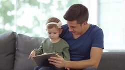 Father and Baby Girl using a Digital Tablet Stock Footage
